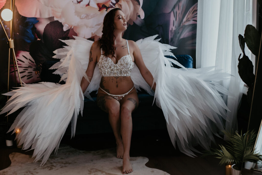 Bay City Michigan boudoir photographer – woman in white lingerie with angel wings